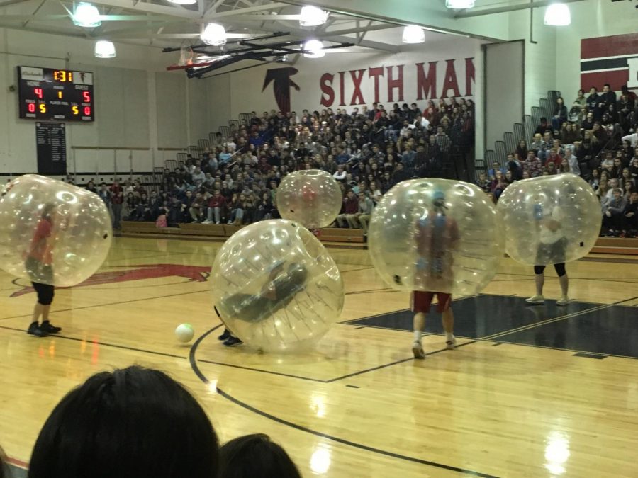 Teacher bubble soccer ends Wellness Week with a smash (and a roll across the gym)