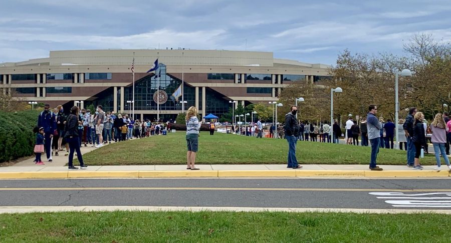Early voters wait in line outside of the Fairfax County Government Center. (MADISON DIETRICH)