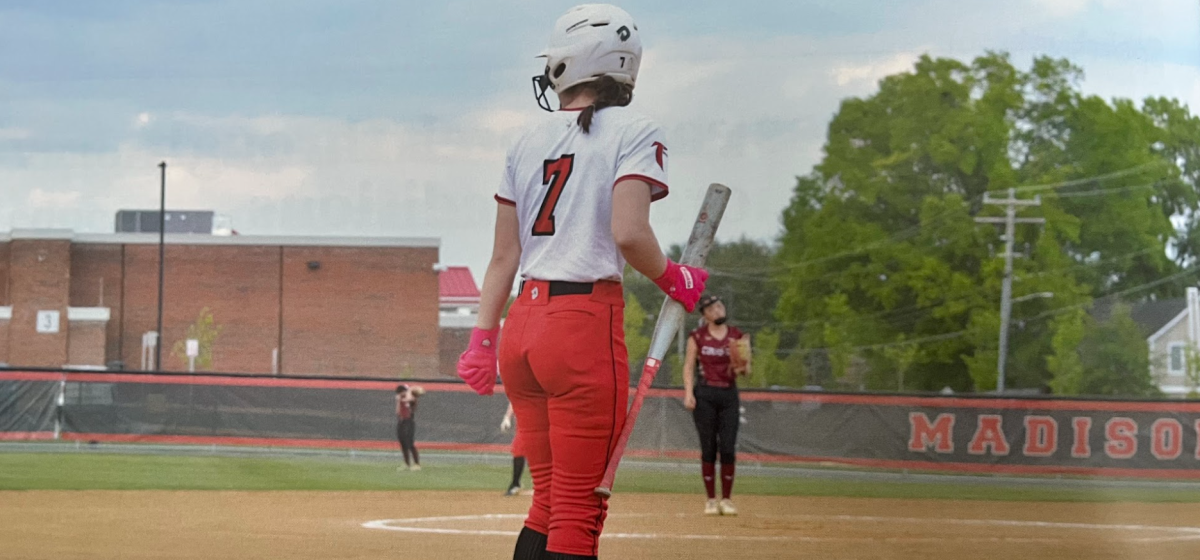 Grace Marshall stands on deck, waiting for her turn at bat. The team beat Oakton on April 24 with a score of 14-3.